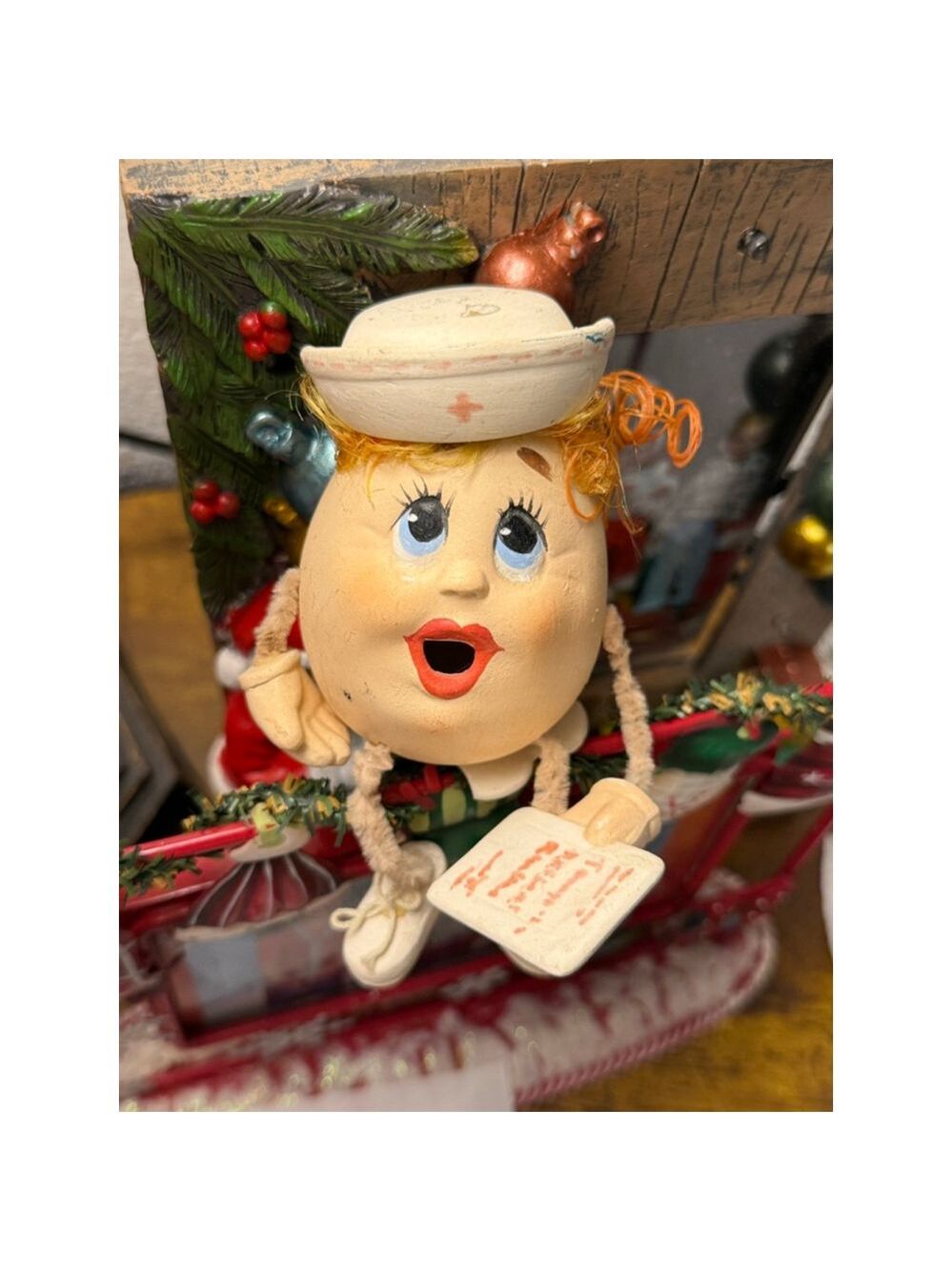 Nurse Egg on a seat red hair red lips shoes and shoestrings!